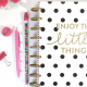 An image of a notebook planner with a design that says "Enjoy the little things"