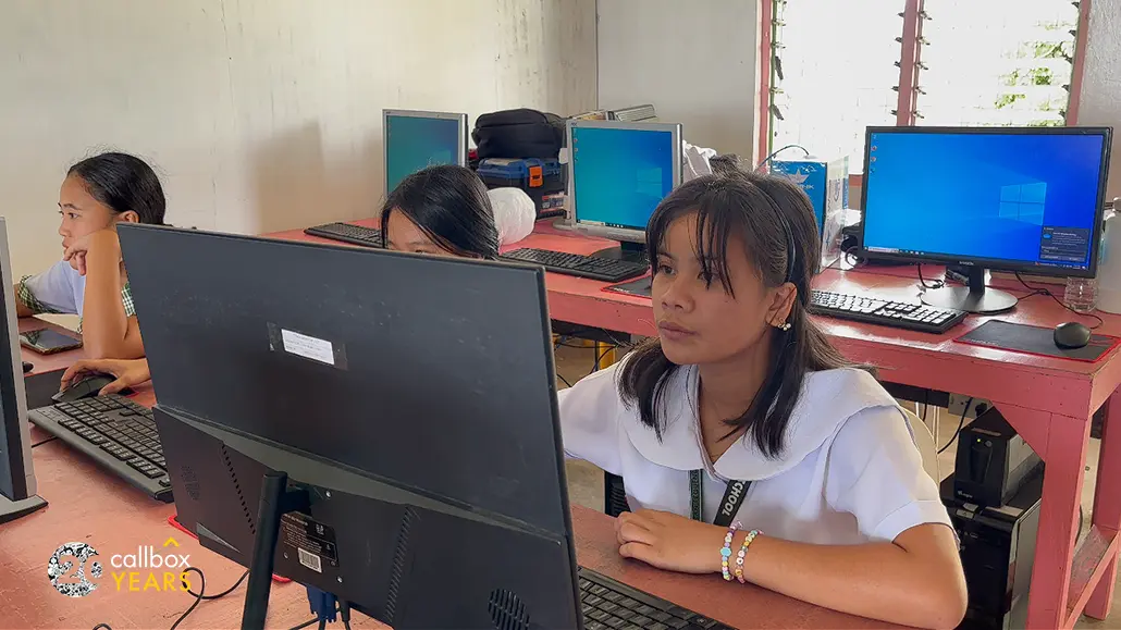 Student learning to use computer
